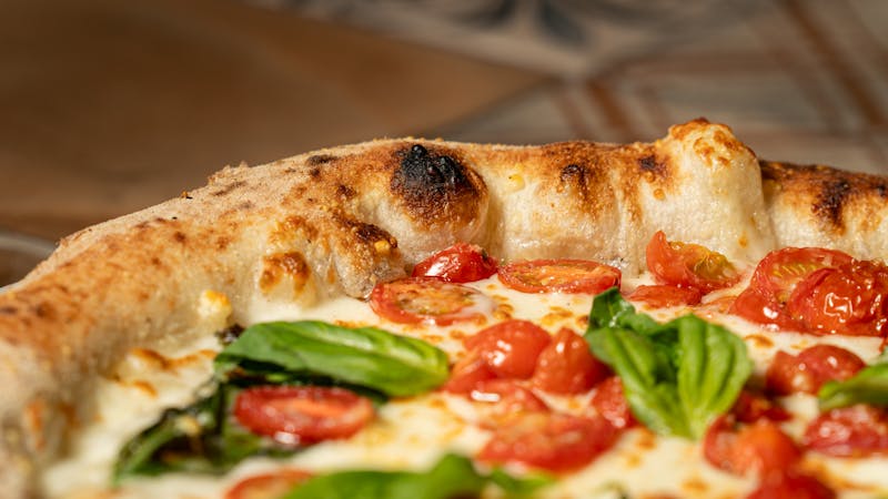 Margherita Punch pizza with fresh mozzarella and basil