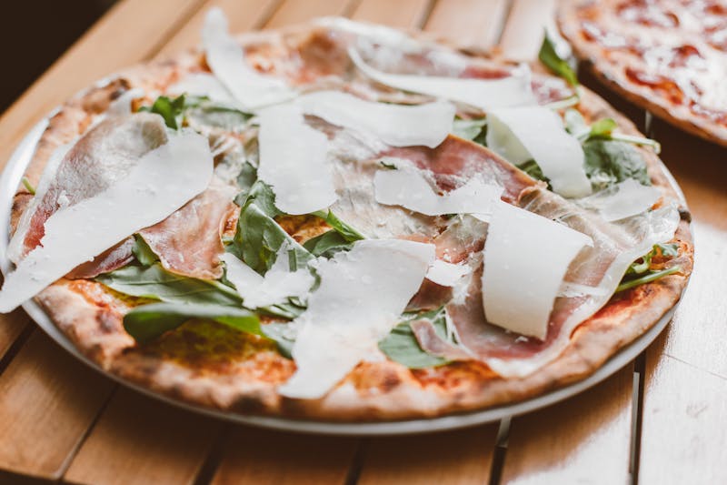 Prosciutto e Rucola pizza with cured ham and arugula